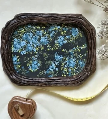 Blue Blossoms. Gouache on paper  ·  Hand-carved frame, artist's own